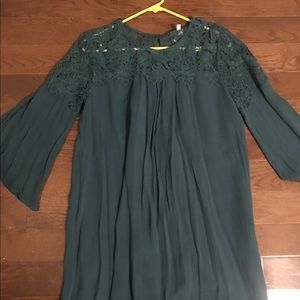 Green dress with shoulder lace detail.